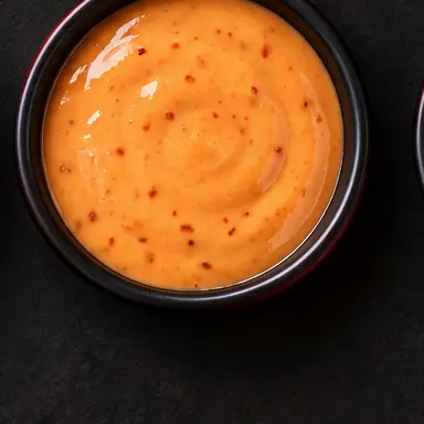 Buffalo Ranch signature sauce in a black bowl