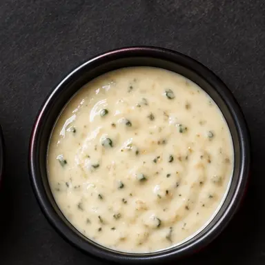 Garlic Parmesan sauce in a black bowl
